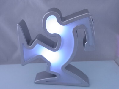 1 x Buchstütze Bücherhalter Regal-Licht LED Farbwechsler Keith Haring