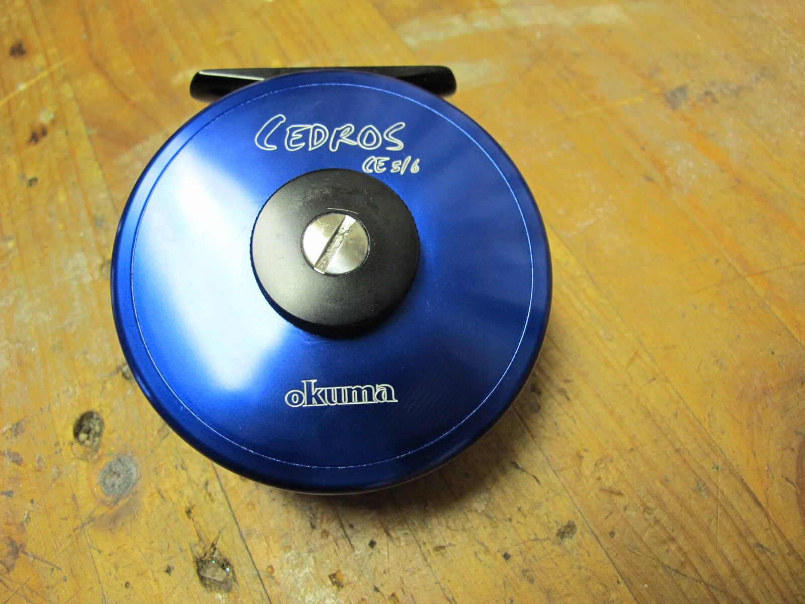 Okuma Cedros CE 5/6 saltwater fly reel with line and neoprene reel cover
