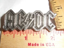 Ac-Dc pin vintage collectible old rock band music concert memorabilia pinback