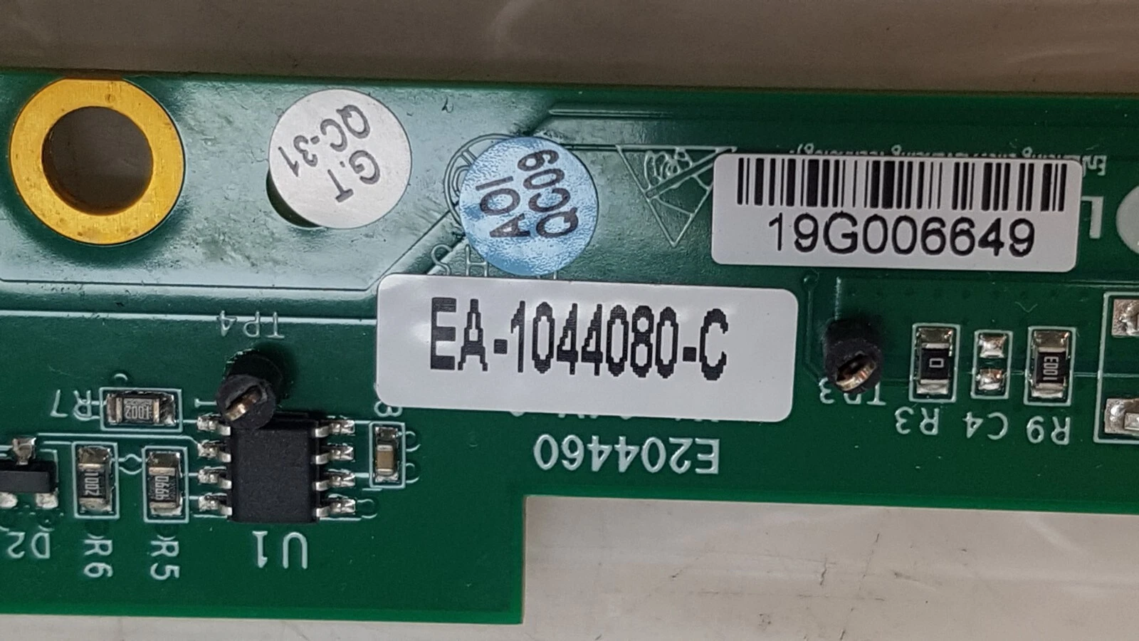 EA-1044080-C assembly label, serial 19G006649, and inspection stickers on the Lumenis board