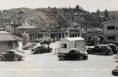 c1940 RPPC Nogales, Arizona Businesses La Jolla Curios, Calzado Cars Postcard