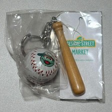 Dije de béisbol Sesame Street Oscar Grouch sin abrir, en bolsas, arañazos