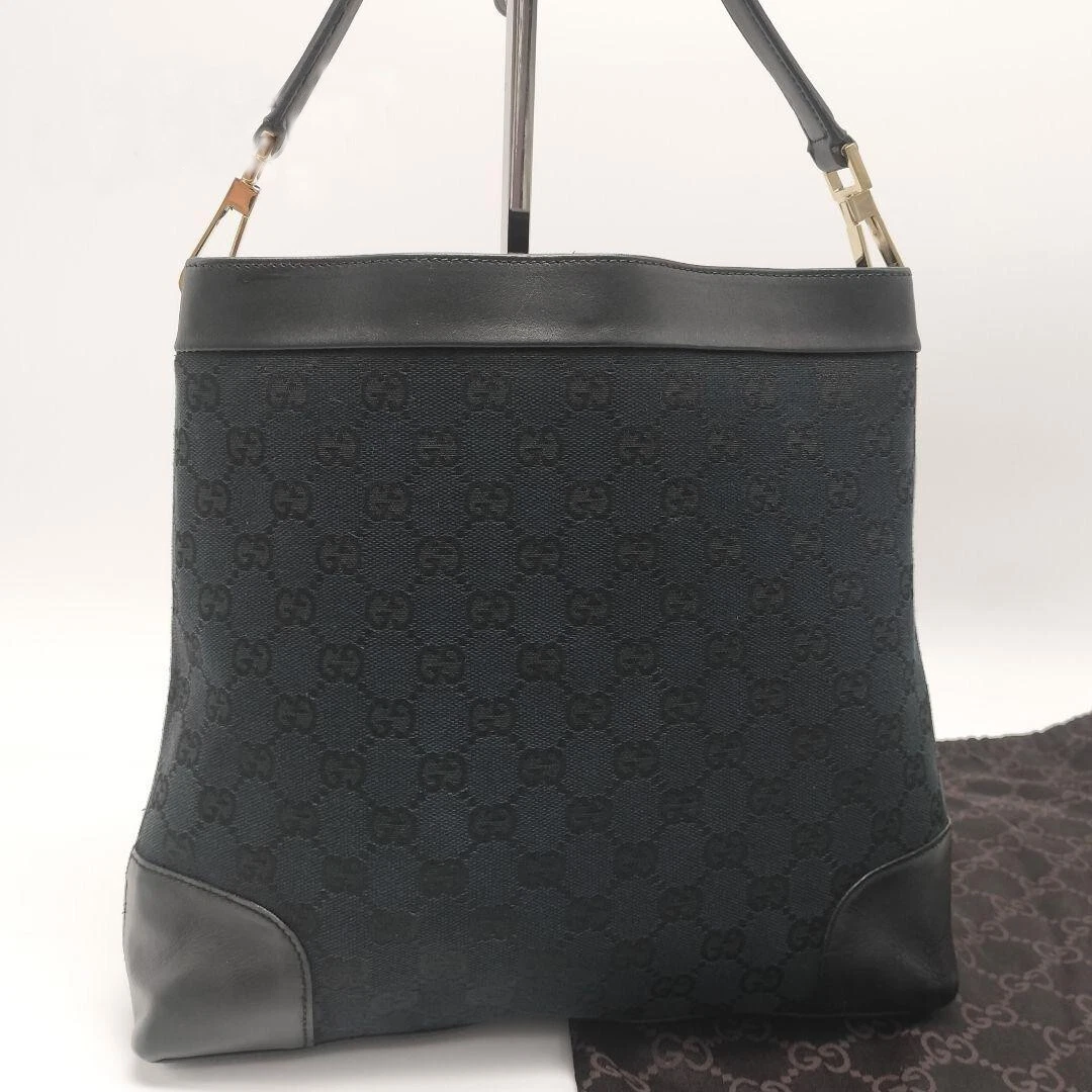 Sac bandoulière femme Gucci motif GG logo toile cuir noir occasion authentique