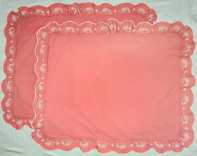 Pair of Yves Delorme muted brick red cotton pillow shams, scalloped edge