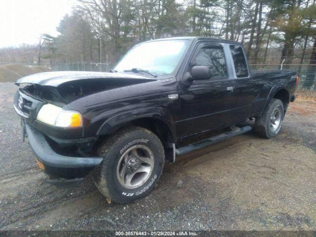 Espejo retrovisor manual izquierdo Mazda B-4000 2001 negro fabricante de equipos originales usado 463980 136 k millas Foto 2 de 4