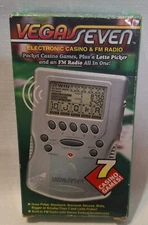 Vegas Seven Electronic Casino Handheld Game & FM Radio 7 Casino Games 
