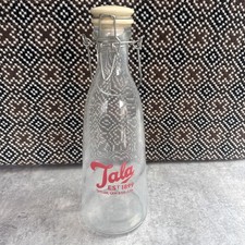 TALA Est 1899 Taylor Law Store Milk Bottle 