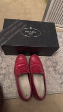pair of red leather penny loafers from Prada