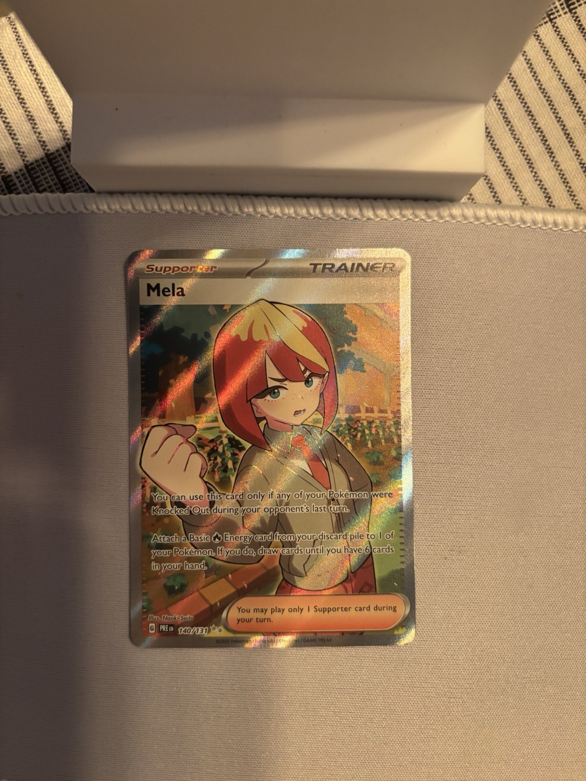 Mela Ultra Rare Holofoil PRE 140/131 NM Pokemon TCG