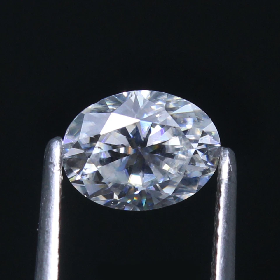 Diamante suelto blanco ovalado 7x5 mm corte excelente certificado DE natural certificado VVS1 Foto 2 de 4