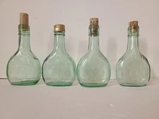 Set Of 4 Almaden Pony Bottles Used
