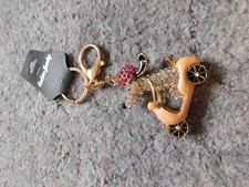 Breast Cancer Now: Dog riding a scooter shaped keyring, split rings - new