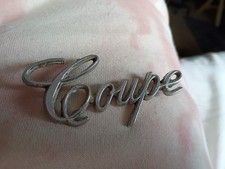 1970s Cadillac Coupe Deville Coupe Rear Fender Emblem Part Number 9691395 1970s Cadillac Coupe Deville Coupe Rear Fender Emblem Part Number 9691395