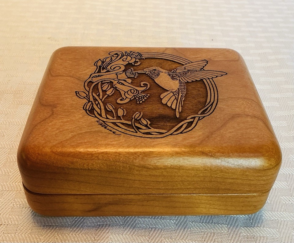 Mid-century modern wood jewelry box with hand-painted folk art birds playing Lara's Theme — rustic charm meets functional keepsake.