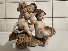 Statuetta porcellana La Medea  Capodimonte - Putti sul covone di grano