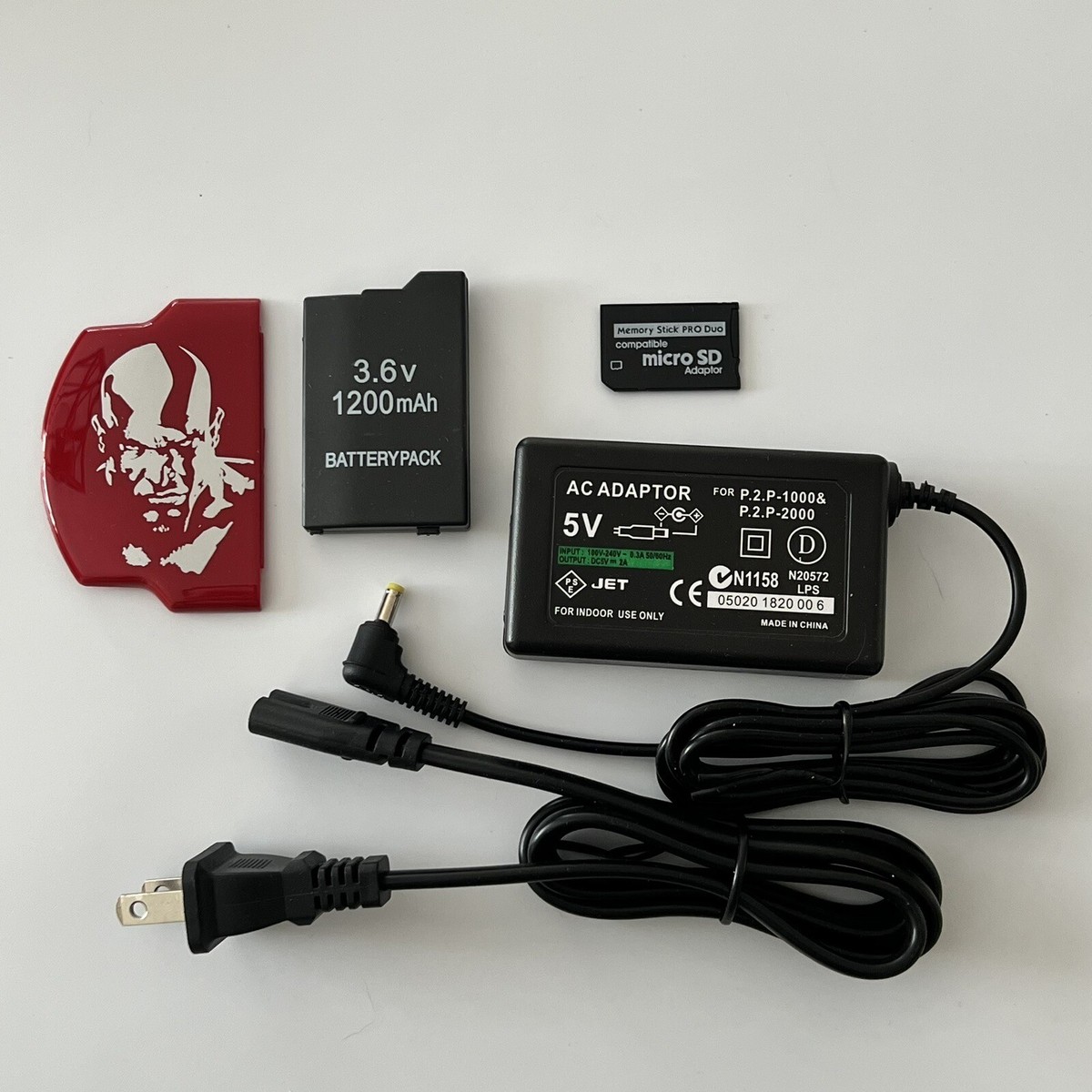QUALITY PSP 2000 Kit - Battery, Charger, God Of War Cover, 16gb