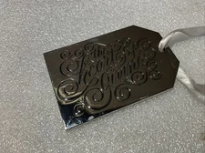 NEIMAN MARCUS Christmas Metal Gift Tag CHROMED  Ornament " THE HEART OF GIVING"