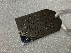 NEIMAN MARCUS Christmas Metal Gift Tag CHROMED  Ornament " THE HEART OF GIVING"