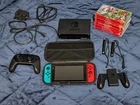 Nintendo Switch with Pro Controller, docking station, case and additional games.