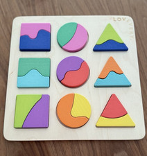 Lovevery Wooden Preschool Geometric Shapes Puzzle Board w/ 9 Colorful Pieces