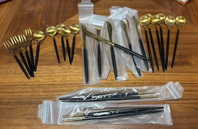 Cutipol-style cutlery set featuring a gold finish and matte black handles 22 Pcs