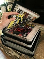 59 Comic books in 3 binders w/protective sleeves