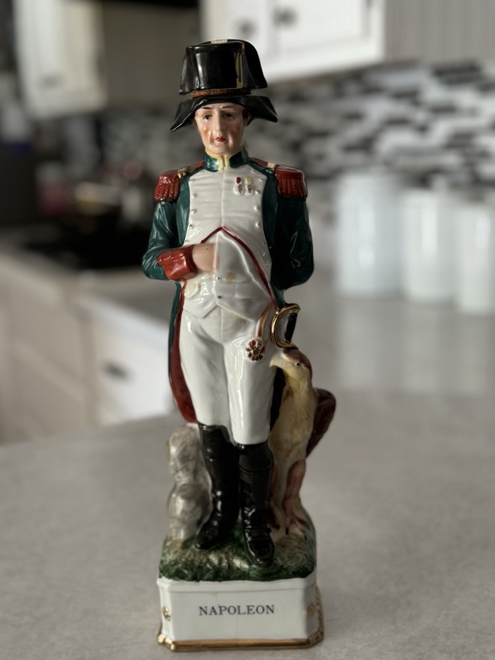 A 1969 Napoleon Grenadier Spirits decanter shaped as a statue — a gloriously over-the-top piece of vintage bottle art that doubles as shelf sculpture.