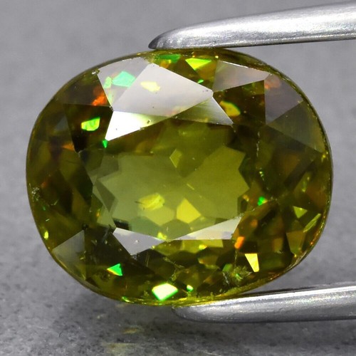2.28ct 8.3x7mm VS Oval Yellowish Green Sphene