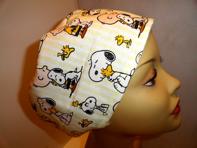 Ladies scrub hat, surgical hat, white dog, and yellow bird. Elastic in back.