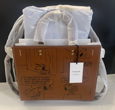 COACH X PEANUTSローグ バッグ・ニュースペーパー プリントブラウン 