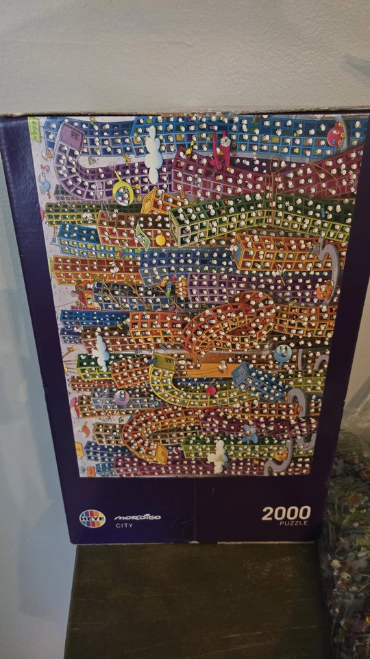 Rompecabezas Heye Mordillo “City” 2000 piezas + póster (completo, caja púrpura 2012) fuera de stock Foto 3 de 4