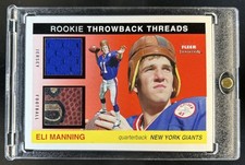 2004 Fleer Tradition Eli Manning Rookie Throwback Threads Jersey/Ball RC #/50