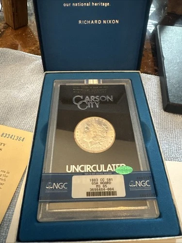 1883-CC $1 GSA Hoard Morgan Dollar NGC MS 65 CAC Box And Card