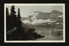 Cameron Lake Waterton PK - A large lake with mountains in the back- Old Photo