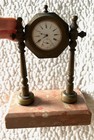 Vintage clock on pink marble stand — photo 1