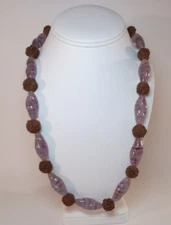 22" purple glass twisted bead and textured fruit pit necklace, barrel clasp