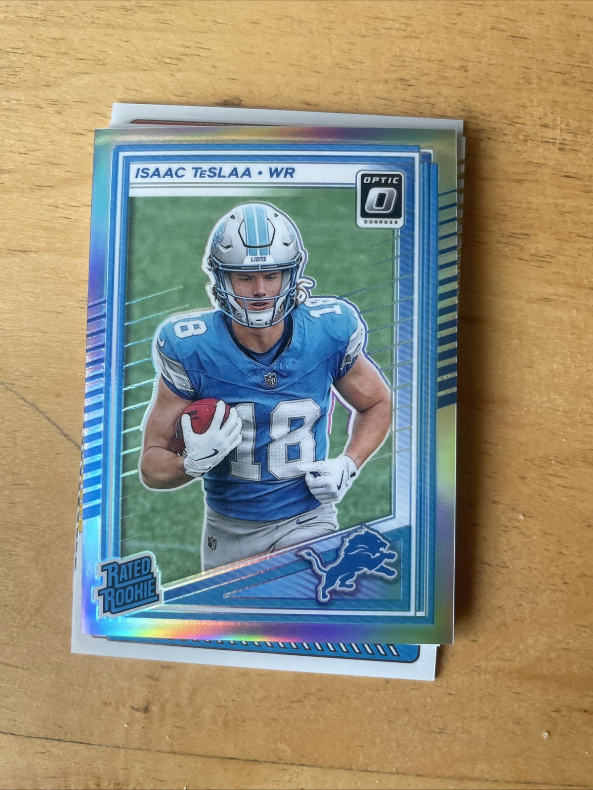 Isaac Teslaa Color Match /249 Blue Prizm 2025 Donruss Optic #219 RC Rookie Lions