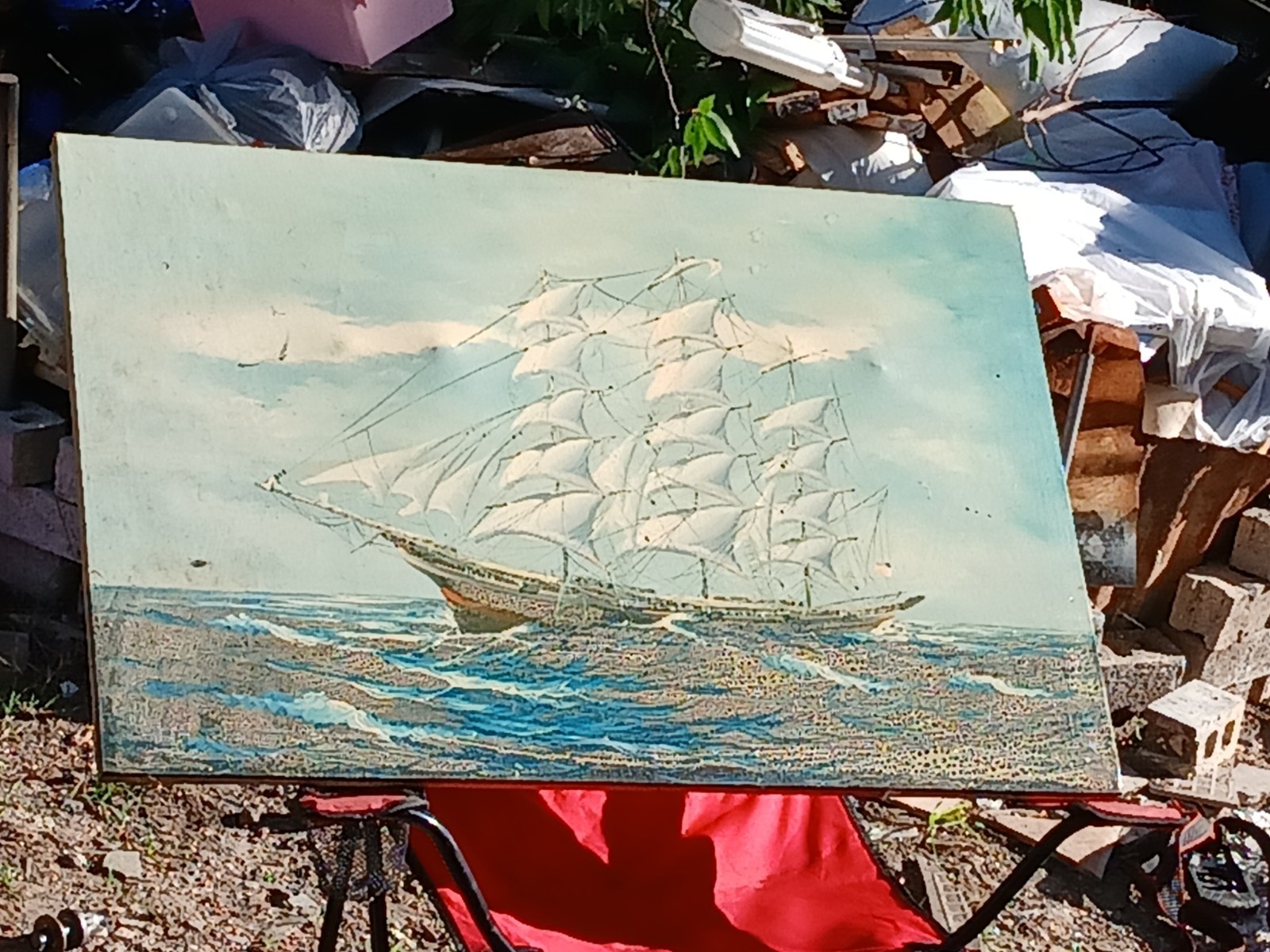 vintage oil-on-canvas artwork depicting a tall ship on rough seas