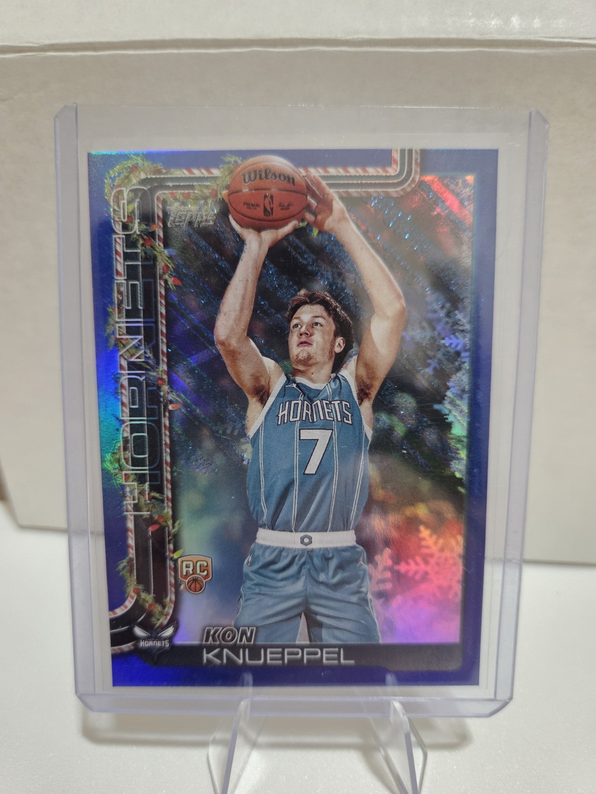2025-26 Topps Holiday Kon Knueppel Blue Metallic Glitter Parallel (RC) #H164