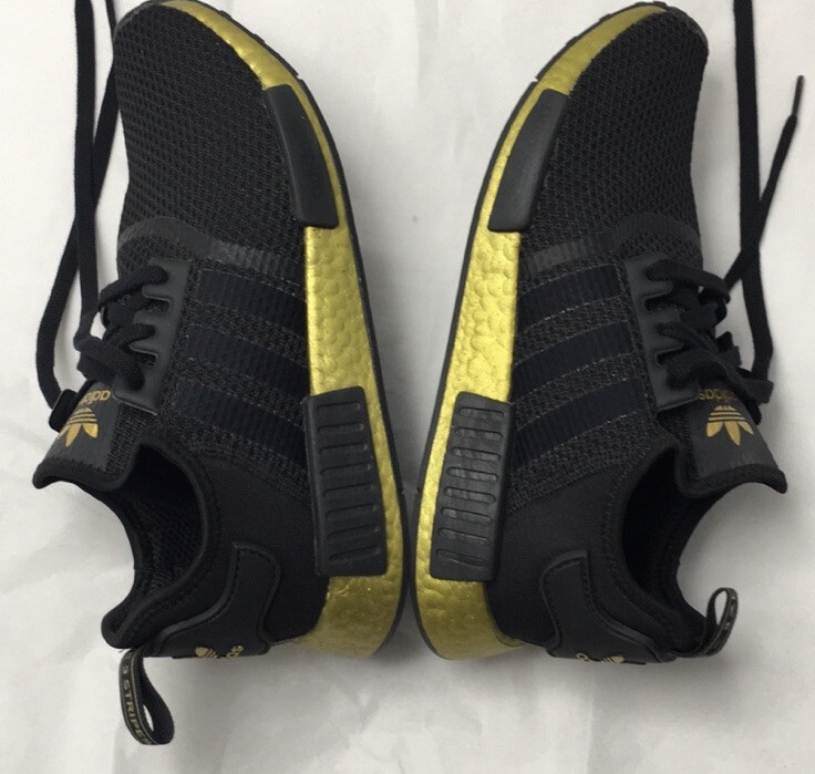 black and gold adidas nmds