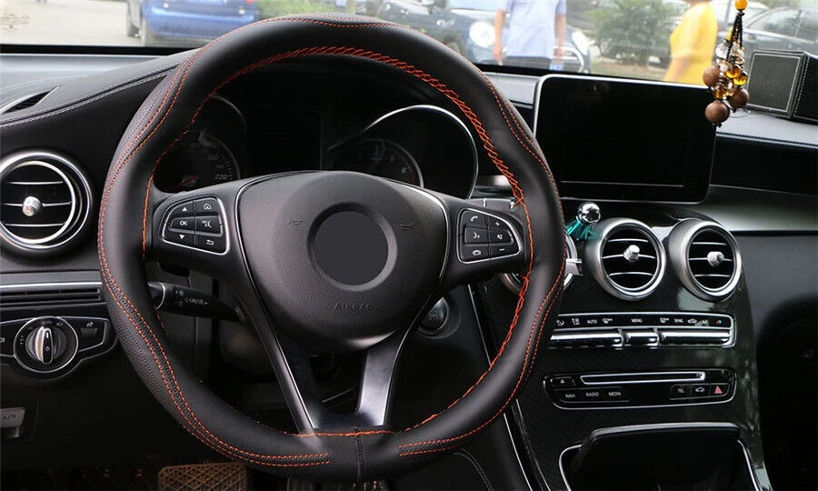 Steering wheel cover with orange stitching