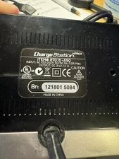 NYKO Wii Remote Charge Station Dock -With Wii remote and two battery packs.