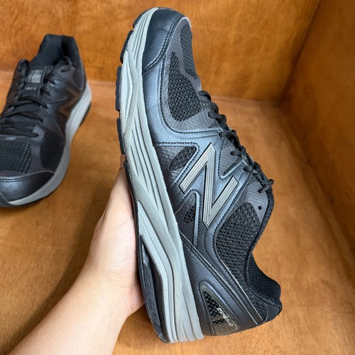 Black and gray New Balance 1540V2 men’s running shoes with silver “N” logo, mesh uppers, and gray midsoles, made in USA.