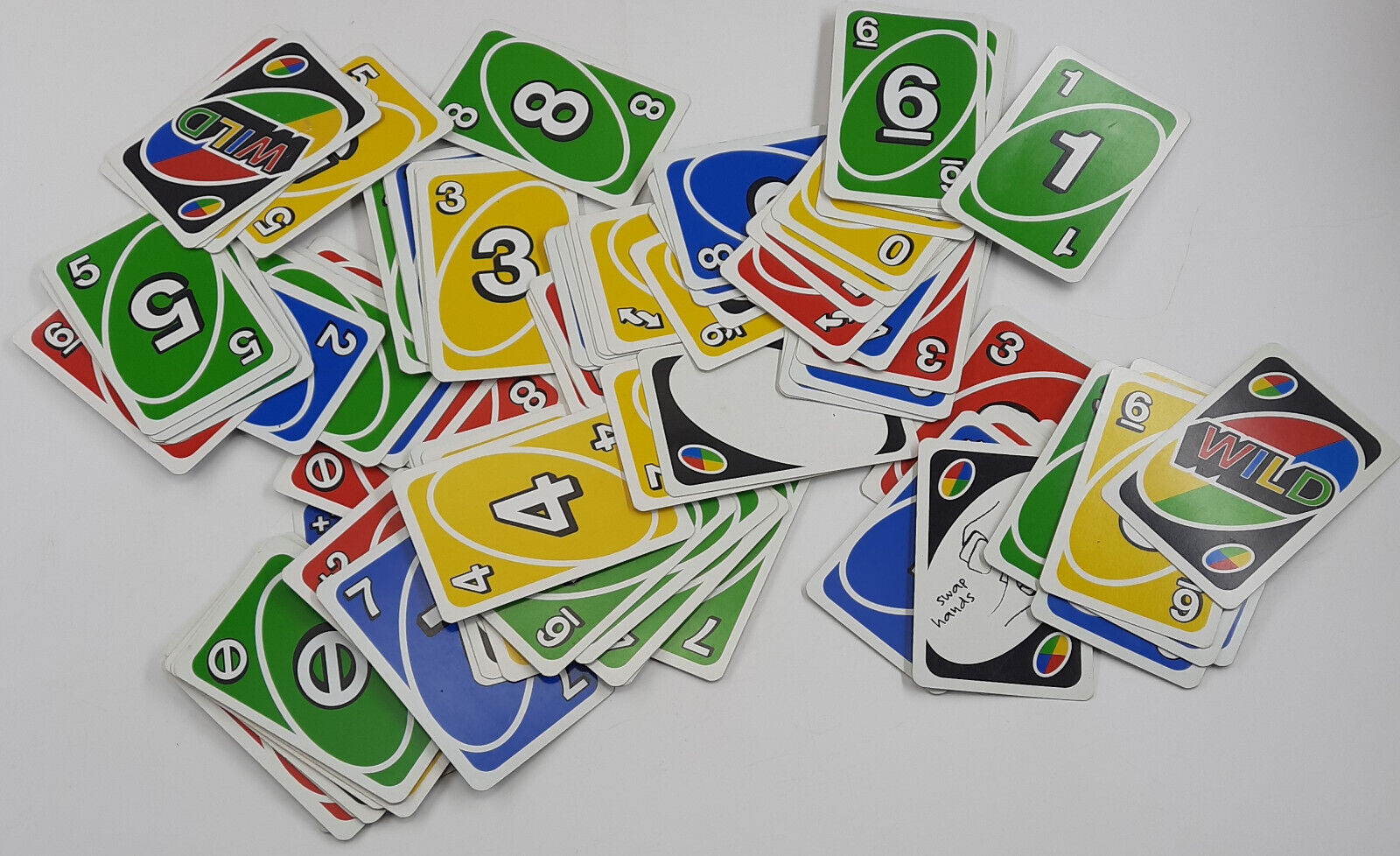 Deck of Uno Game Cards Scattered All Over on a Table. American