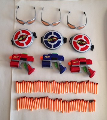 2005 NERF 1-on-1 Toy Blasters + Arm Shield Targets + Eyeglasses + 72 FOAM DARTS