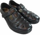 Black leather SAS Roamer women’s casual shoes with side cutouts, mesh straps, and visible air-cushion heels.