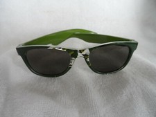 Child's olive green sun glasses with camo design in front