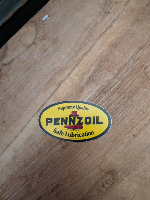This sticker features the vintage Pennzoil "Safe Lubrication" branding in an...