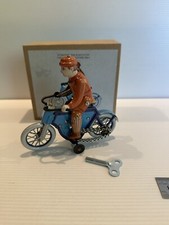 CLOCKWORK TIN RIDER ON BICYCLE MADE IN CHINA.
