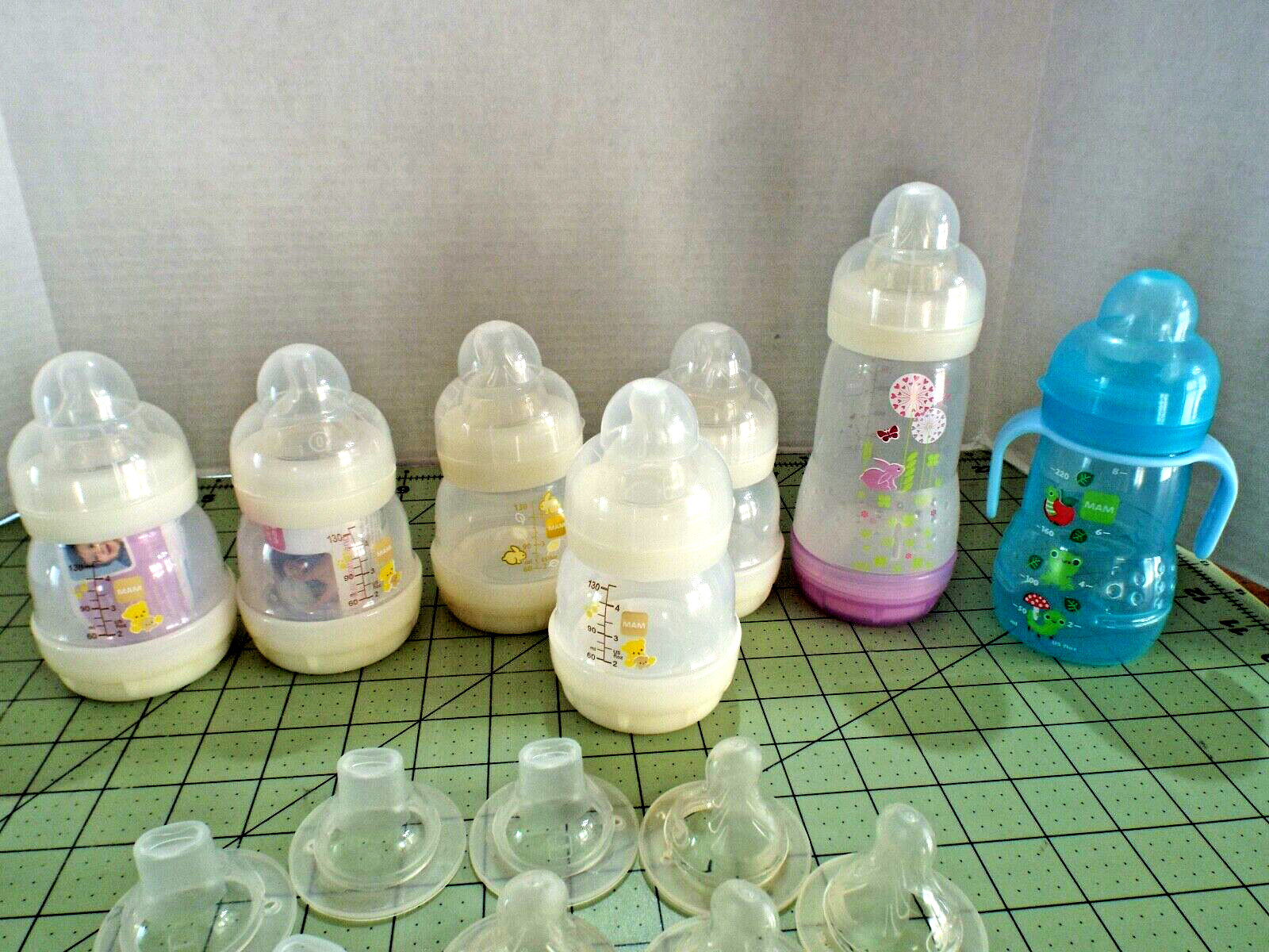 6  MAM Baby Bottles 5-5oz, 1-9oz, 1 Sippy Cup & Extras NEW and USED